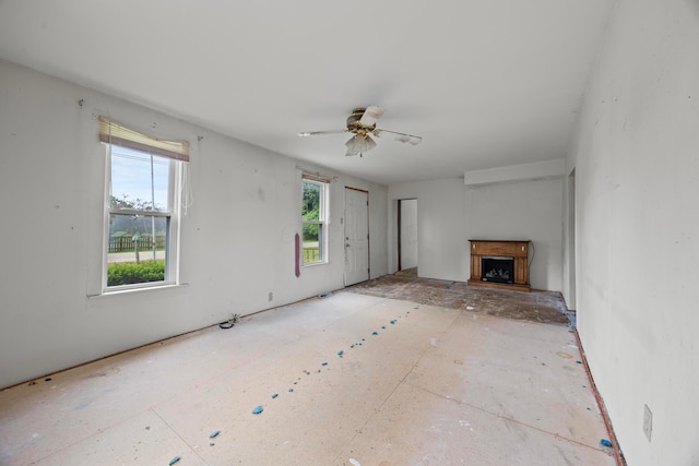 1716 Homer Rd NW, Utica, OH 43080 - unfurnished living room featuring a fireplace with raised hearth and ceiling fan