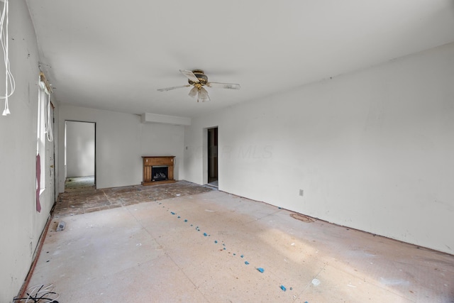 1716 Homer Rd NW, Utica, OH 43080 - unfurnished living room featuring a fireplace with raised hearth and a ceiling fan
