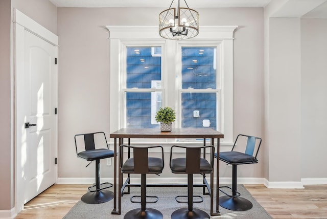 743 Reinhard Ave, Columbus, OH 43206 - dining space featuring a chandelier and light wood finished floors