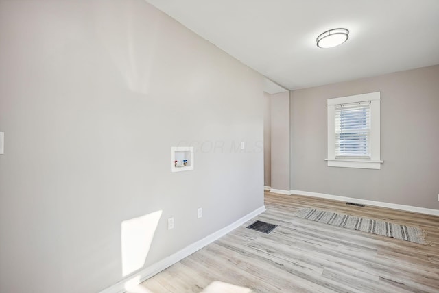 743 Reinhard Ave, Columbus, OH 43206 - washroom with hookup for a washing machine and wood finished floors