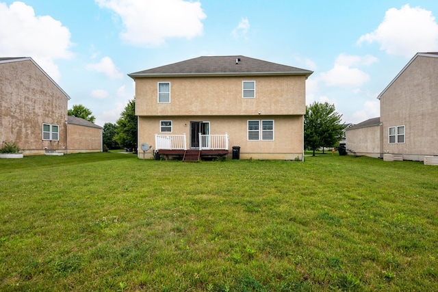 8101 Orange Station Loop, Lewis Center, OH 43035 - back of property featuring a wooden deck, stucco siding, and a yard