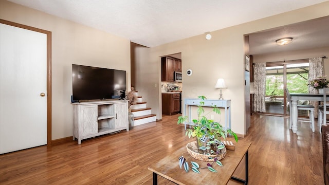 637 Livingston Ct, Heath, OH 43056 - living area featuring light wood-type flooring and stairs