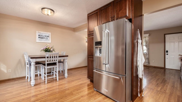 637 Livingston Ct, Heath, OH 43056 - kitchen featuring high end refrigerator, a textured ceiling, and light wood-style floors