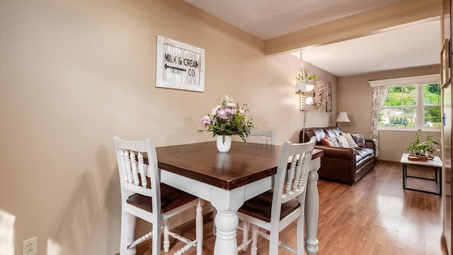 637 Livingston Ct, Heath, OH 43056 - dining room with light wood finished floors and beamed ceiling