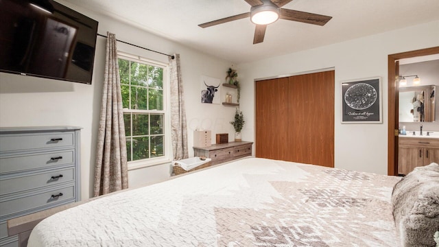 637 Livingston Ct, Heath, OH 43056 - bedroom with a closet, connected bathroom, and a ceiling fan