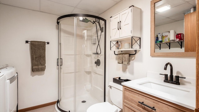 637 Livingston Ct, Heath, OH 43056 - full bathroom featuring separate washer and dryer, a paneled ceiling, a stall shower, and vanity