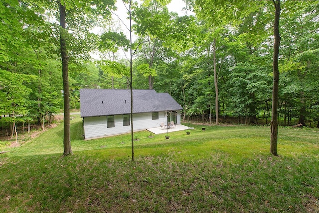 2499 Apple Valley Dr, Howard, OH 43028 - back of house with a patio area, a yard, and a wooded view