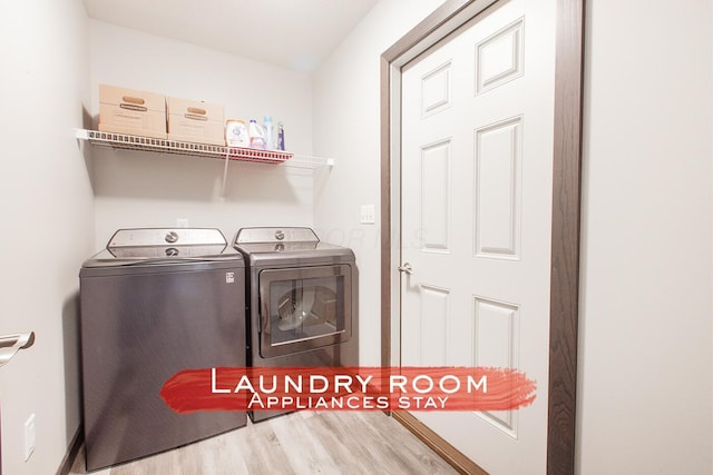 2499 Apple Valley Dr, Howard, OH 43028 - laundry room with separate washer and dryer and wood finished floors