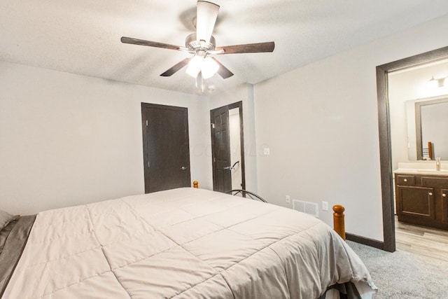 2499 Apple Valley Dr, Howard, OH 43028 - bedroom with light carpet, ensuite bathroom, and ceiling fan