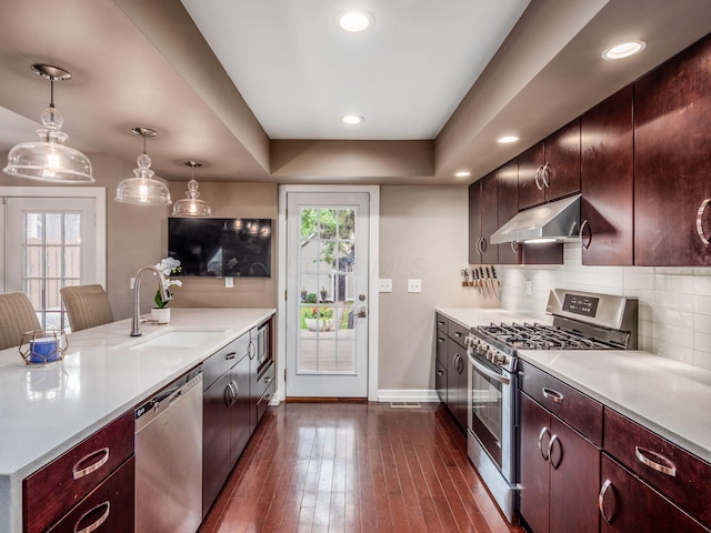 1243 Harrison Ave, Columbus, OH 43201 - kitchen with appliances with stainless steel finishes, under cabinet range hood, light countertops, plenty of natural light, and recessed lighting