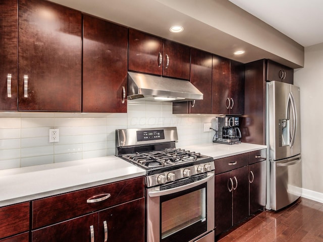 1243 Harrison Ave, Columbus, OH 43201 - kitchen with extractor fan, appliances with stainless steel finishes, dark wood finished floors, light countertops, and tasteful backsplash