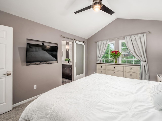 1243 Harrison Ave, Columbus, OH 43201 - carpeted bedroom featuring lofted ceiling, a barn door, ensuite bathroom, and ceiling fan