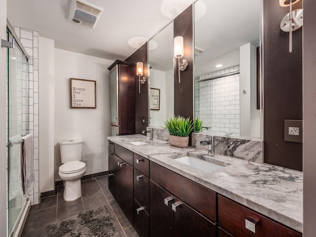 1243 Harrison Ave, Columbus, OH 43201 - bathroom with double vanity, a shower stall, and tile patterned floors