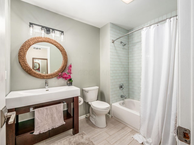 1243 Harrison Ave, Columbus, OH 43201 - bathroom featuring shower / bath combo, vanity, and wood finished floors