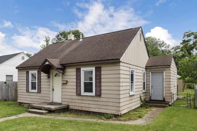 846 4th St, Lancaster, OH 43130 - view of front of house featuring a shingled roof and a gate