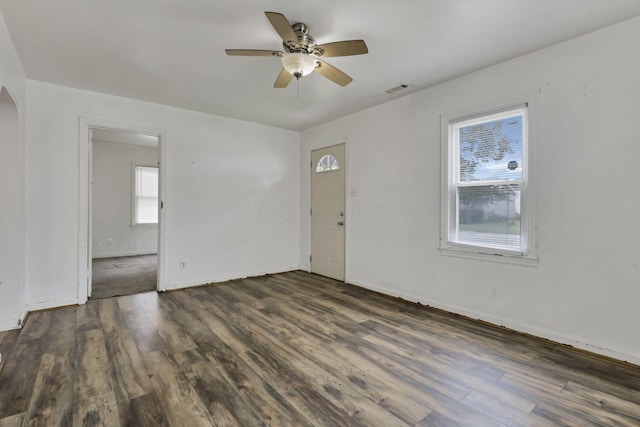 846 4th St, Lancaster, OH 43130 - unfurnished room featuring ceiling fan, dark wood-type flooring, and arched walkways