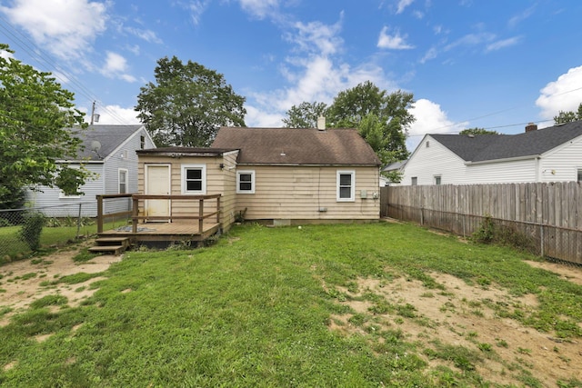 846 4th St, Lancaster, OH 43130 - back of property with a fenced backyard, a deck, and a chimney