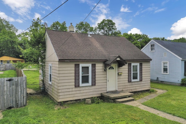 846 4th St, Lancaster, OH 43130 - view of front of property featuring a shingled roof and a chimney