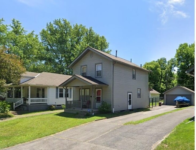 85 Landers Ave, Columbus, OH 43207 - view of front of property featuring covered porch, an outdoor structure, a front yard, a detached garage, and crawl space