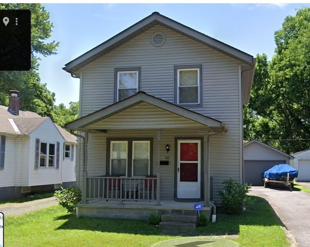 85 Landers Ave, Columbus, OH 43207 - view of front of property featuring covered porch, a garage, a front yard, and an outdoor structure