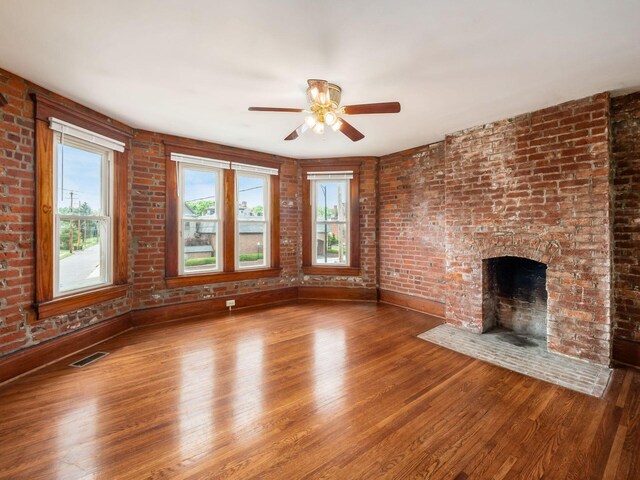1360 S High St, Columbus, OH 43207 - unfurnished living room with healthy amount of natural light, wood finished floors, and ceiling fan