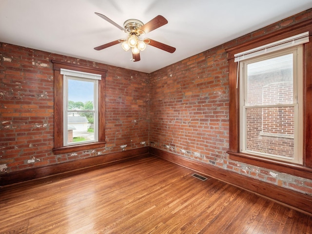 1360 S High St, Columbus, OH 43207 - spare room featuring wood finished floors and ceiling fan