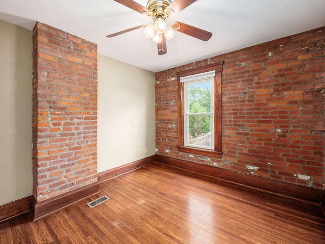 1360 S High St, Columbus, OH 43207 - empty room with wood finished floors and a ceiling fan