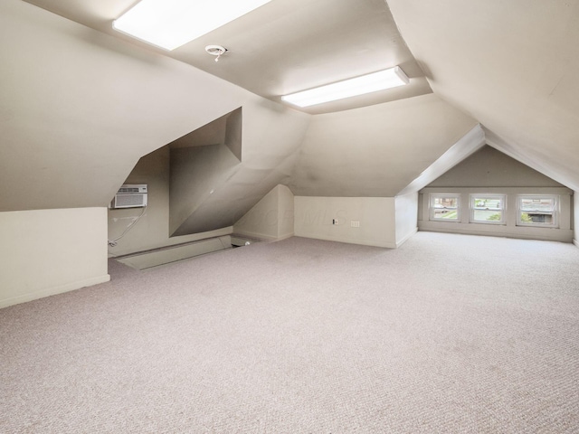 1360 S High St, Columbus, OH 43207 - bonus room with a wall mounted air conditioner, lofted ceiling, and carpet floors
