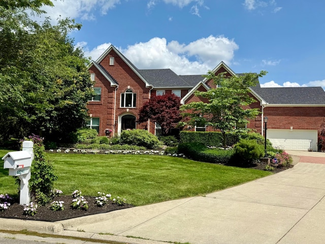 6941 Lakeside Ct, Westerville, OH 43082 - traditional-style home with brick siding, a front yard, and a garage