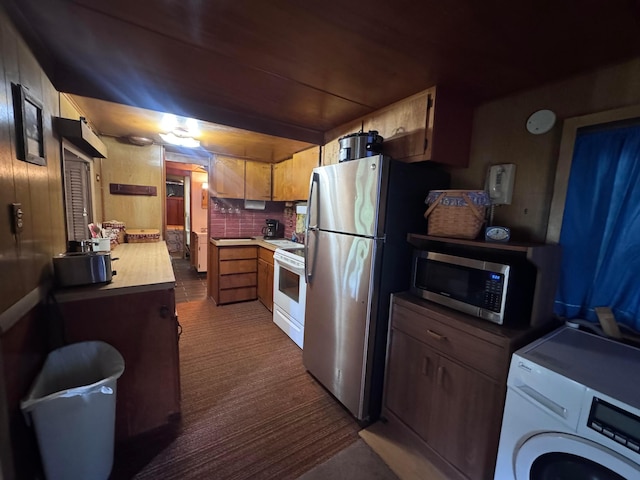 1470 S Riverview Rd, Malta, OH 43758 - kitchen featuring washer / dryer, appliances with stainless steel finishes, light countertops, dark carpet, and tasteful backsplash
