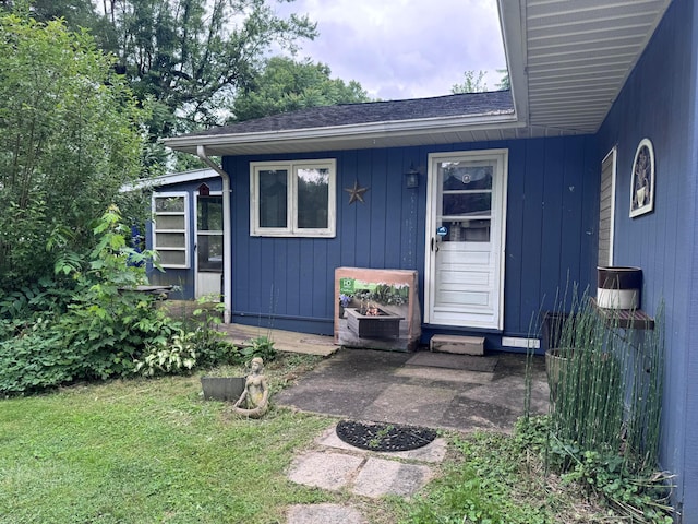 1470 S Riverview Rd, Malta, OH 43758 - doorway to property featuring a yard and roof with shingles