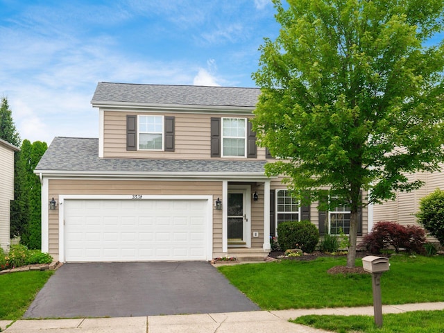 3538 Rosburg Dr, Columbus, OH 43228 - traditional-style home featuring driveway, a front yard, roof with shingles, and an attached garage