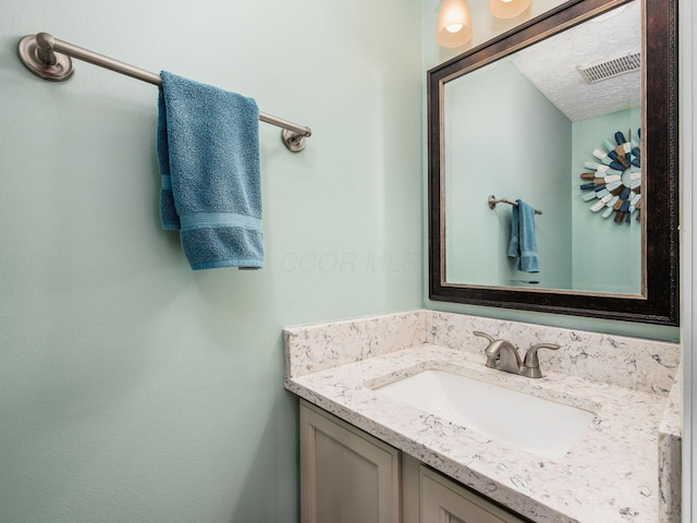 3538 Rosburg Dr, Columbus, OH 43228 - bathroom featuring vanity and a textured ceiling