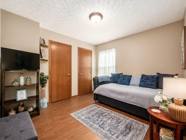 3538 Rosburg Dr, Columbus, OH 43228 - living area with wood finished floors and a textured ceiling