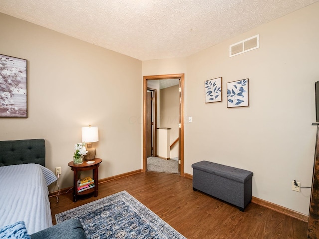 3538 Rosburg Dr, Columbus, OH 43228 - bedroom featuring wood finished floors and a textured ceiling