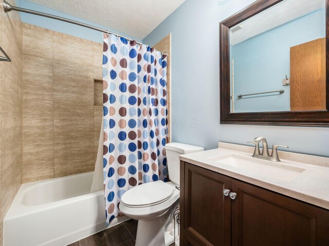 3538 Rosburg Dr, Columbus, OH 43228 - full bathroom featuring vanity, shower / tub combo, wood finished floors, and a textured ceiling