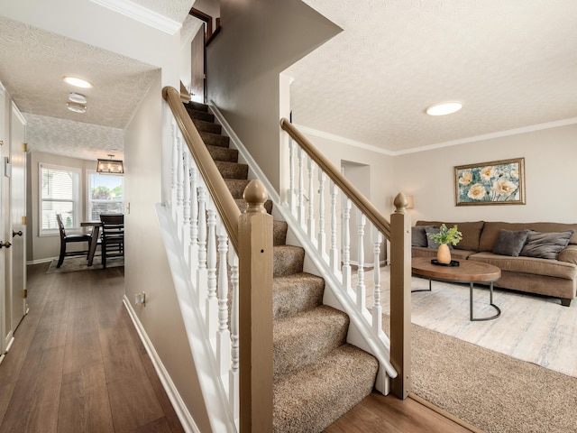 3538 Rosburg Dr, Columbus, OH 43228 - stairway with a textured ceiling, wood finished floors, and ornamental molding