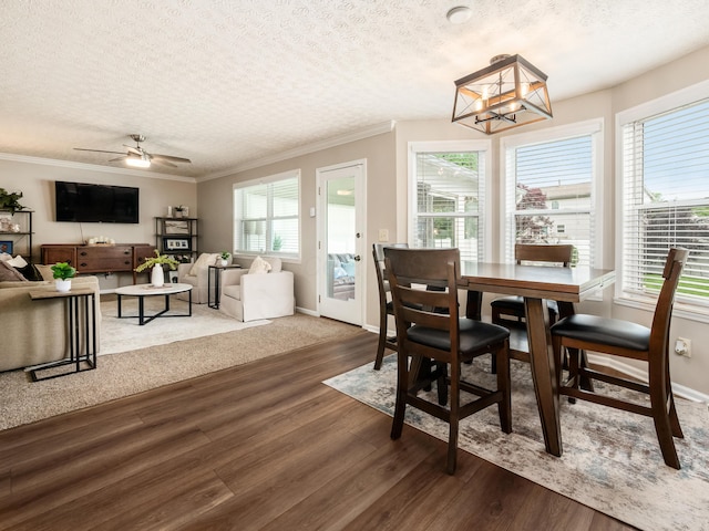 3538 Rosburg Dr, Columbus, OH 43228 - dining room featuring wood finished floors, plenty of natural light, a textured ceiling, a chandelier, and a ceiling fan