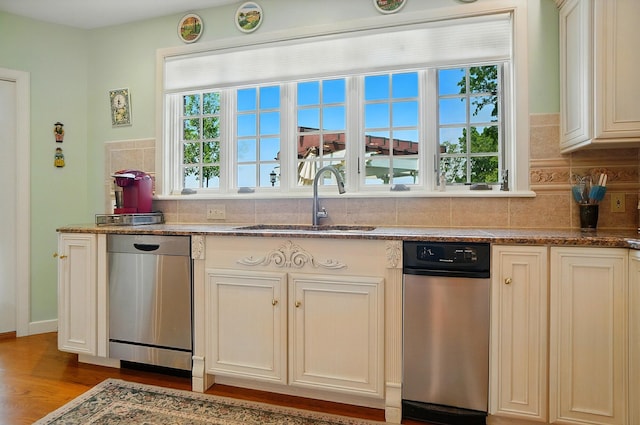 2475 Signal Hill Rd, Springfield, OH 45504 - kitchen with dishwasher, tasteful backsplash, dark stone counters, and wood finished floors