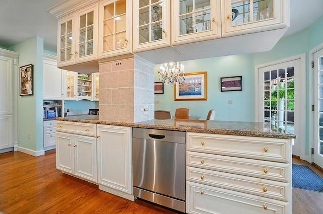 2475 Signal Hill Rd, Springfield, OH 45504 - kitchen featuring dishwasher, wood finished floors, stone counters, a chandelier, and glass insert cabinets