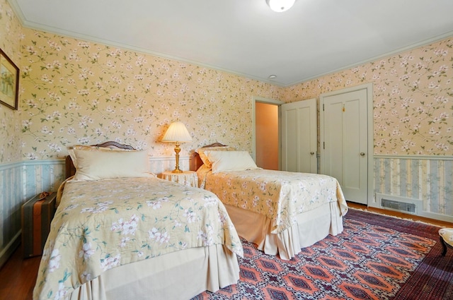 2475 Signal Hill Rd, Springfield, OH 45504 - bedroom with wallpapered walls, ornamental molding, wood finished floors, and wainscoting
