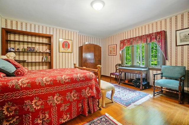 2475 Signal Hill Rd, Springfield, OH 45504 - bedroom with wallpapered walls, crown molding, and wood finished floors