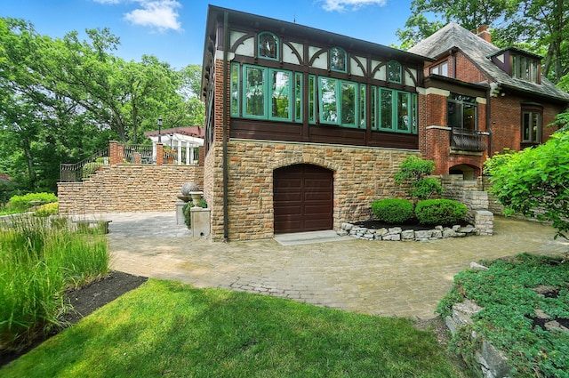 2475 Signal Hill Rd, Springfield, OH 45504 - english style home featuring stone siding and a garage