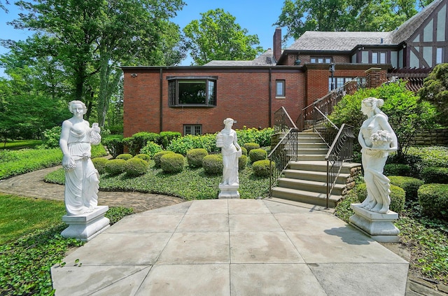 2475 Signal Hill Rd, Springfield, OH 45504 - view of front of property featuring brick siding, stairway, and a chimney