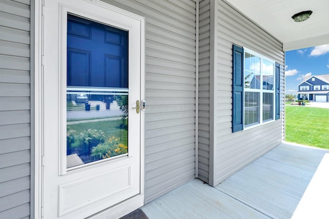 166 Rosewood Loop SE, Commercial Point, OH 43116 - doorway to property with covered porch