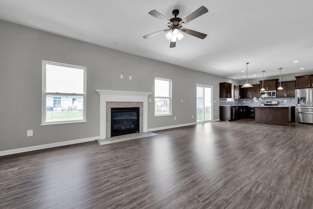 166 Rosewood Loop SE, Commercial Point, OH 43116 - unfurnished living room with recessed lighting, a fireplace, ceiling fan, and dark wood-style flooring