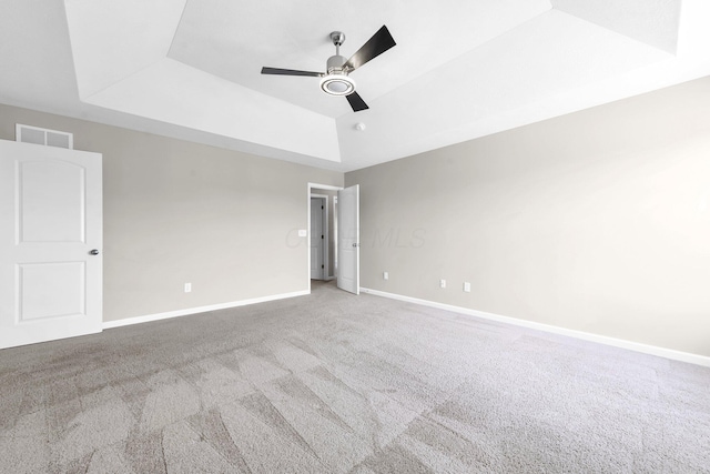 166 Rosewood Loop SE, Commercial Point, OH 43116 - spare room with a tray ceiling, carpet floors, and ceiling fan
