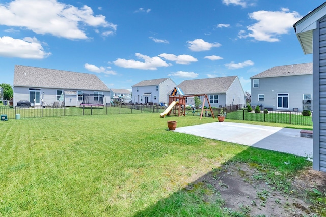 166 Rosewood Loop SE, Commercial Point, OH 43116 - fenced backyard featuring a playground, a residential view, and a patio