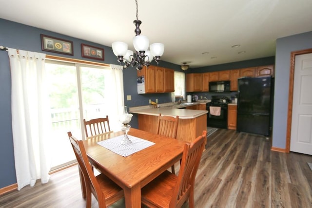 264 Ridgeway Dr, Howard, OH 43028 - dining space featuring a chandelier and dark wood-style floors