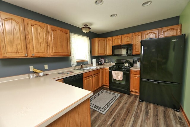 264 Ridgeway Dr, Howard, OH 43028 - kitchen featuring black appliances, light countertops, dark wood-type flooring, and recessed lighting